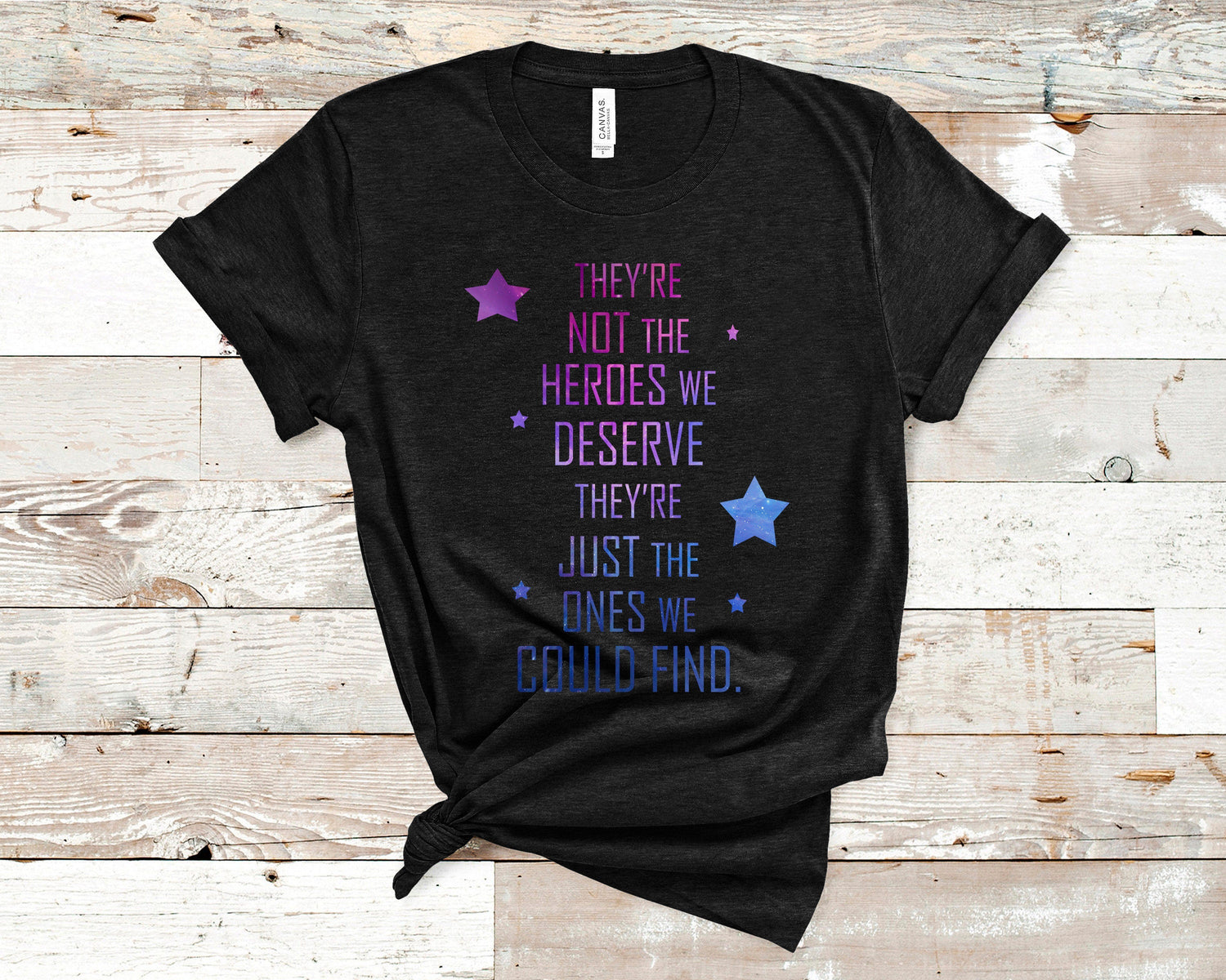 A black tshirt that has a quote on it from Aurora Rising.