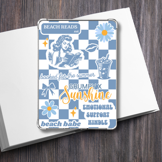 Grumpy x Sunshine Summer Kindle Insert for Clear Case sitting on a plain white book