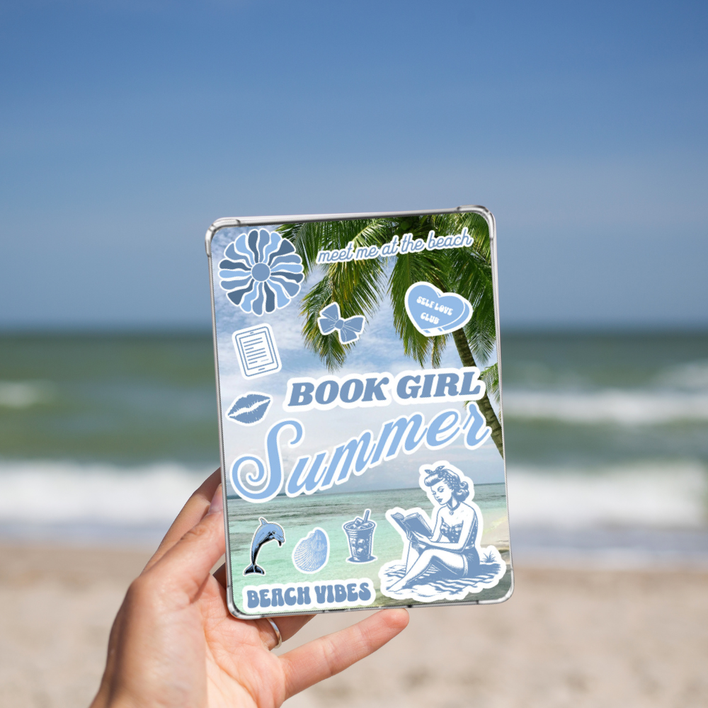 Woman holding the Book Girl Summer Kindle Insert for Clear Case while on a beach