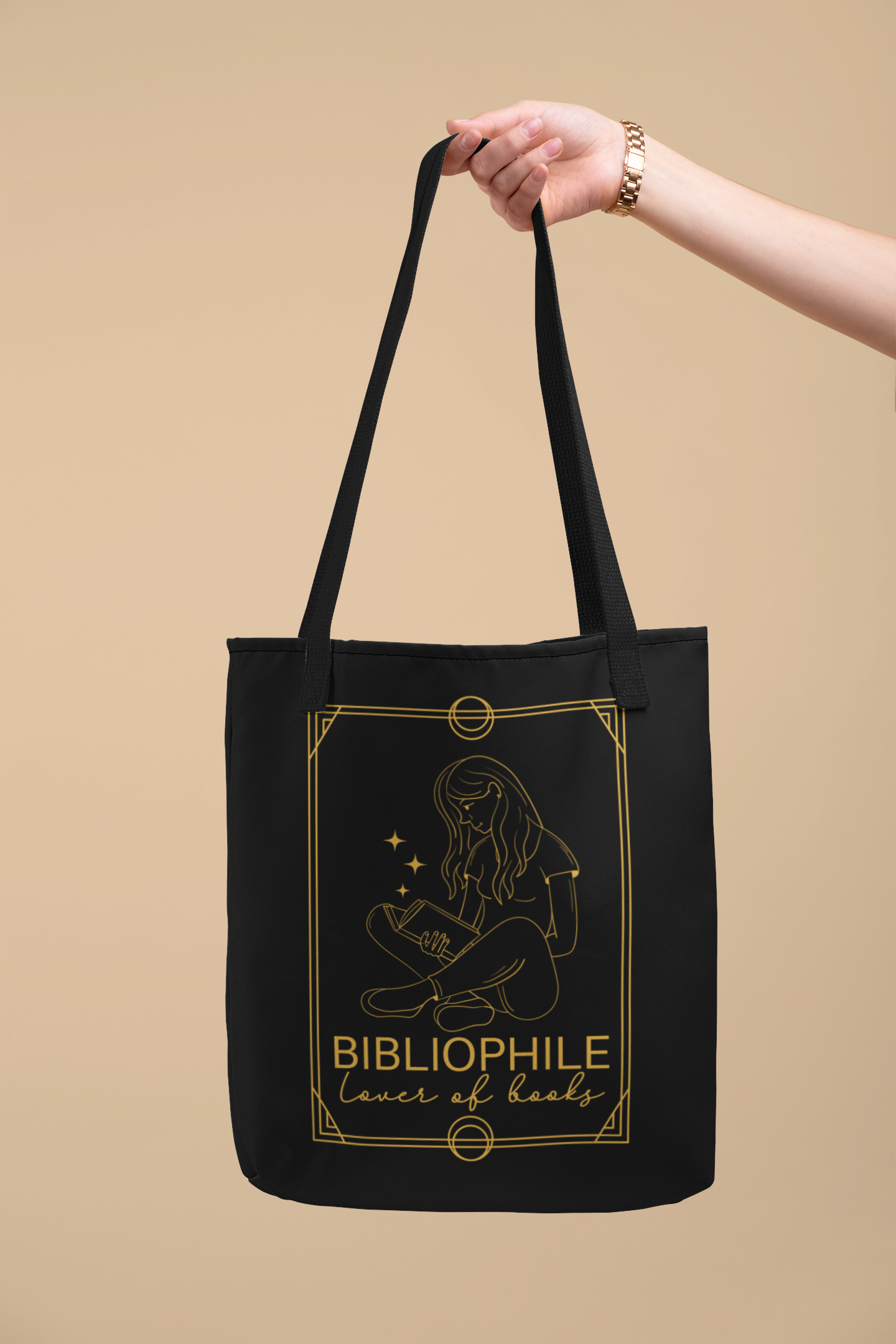 Arm holding out the Bibliophile Tarot Card Bookish Tote Bag