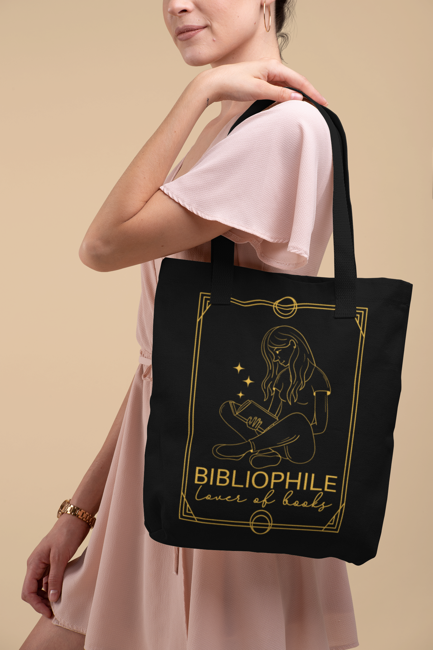 Woman in pink dress holding the Bibliophile Tarot Card Bookish Tote Bag