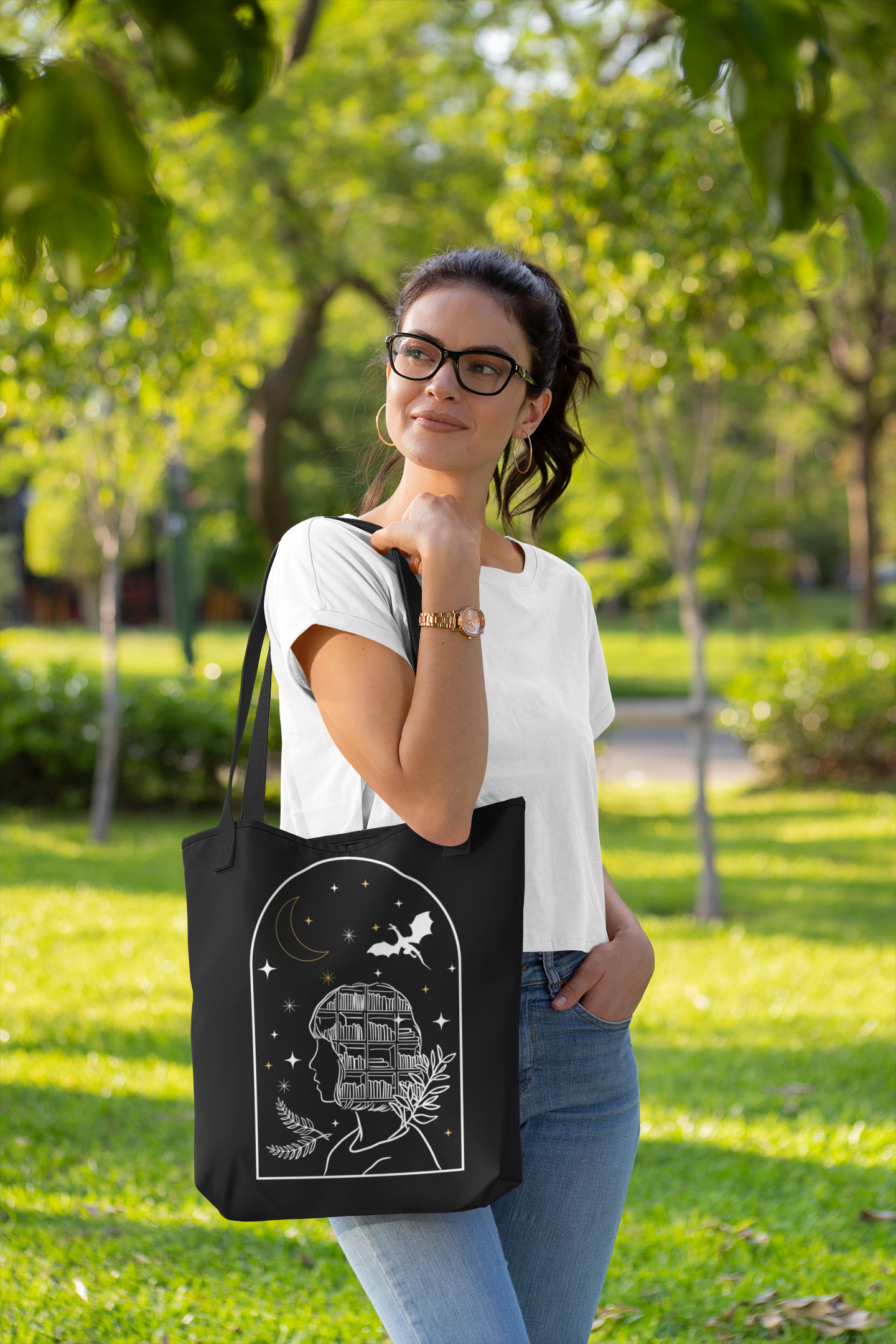 Woman holding the Bookish Fantasy Girl Tote Bag