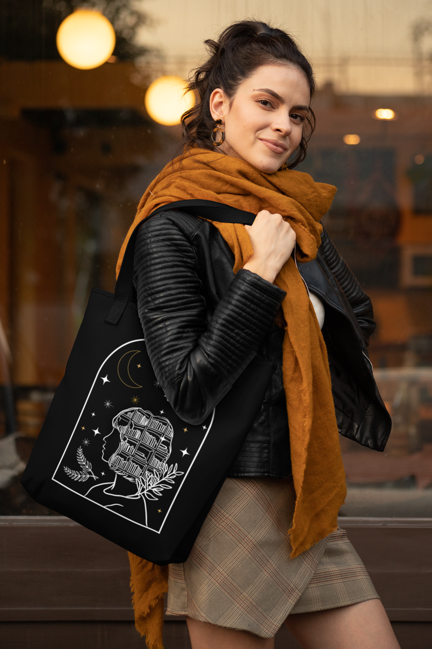 Woman in scarf wearing the Bookish Fantasy Girl Tote Bag
