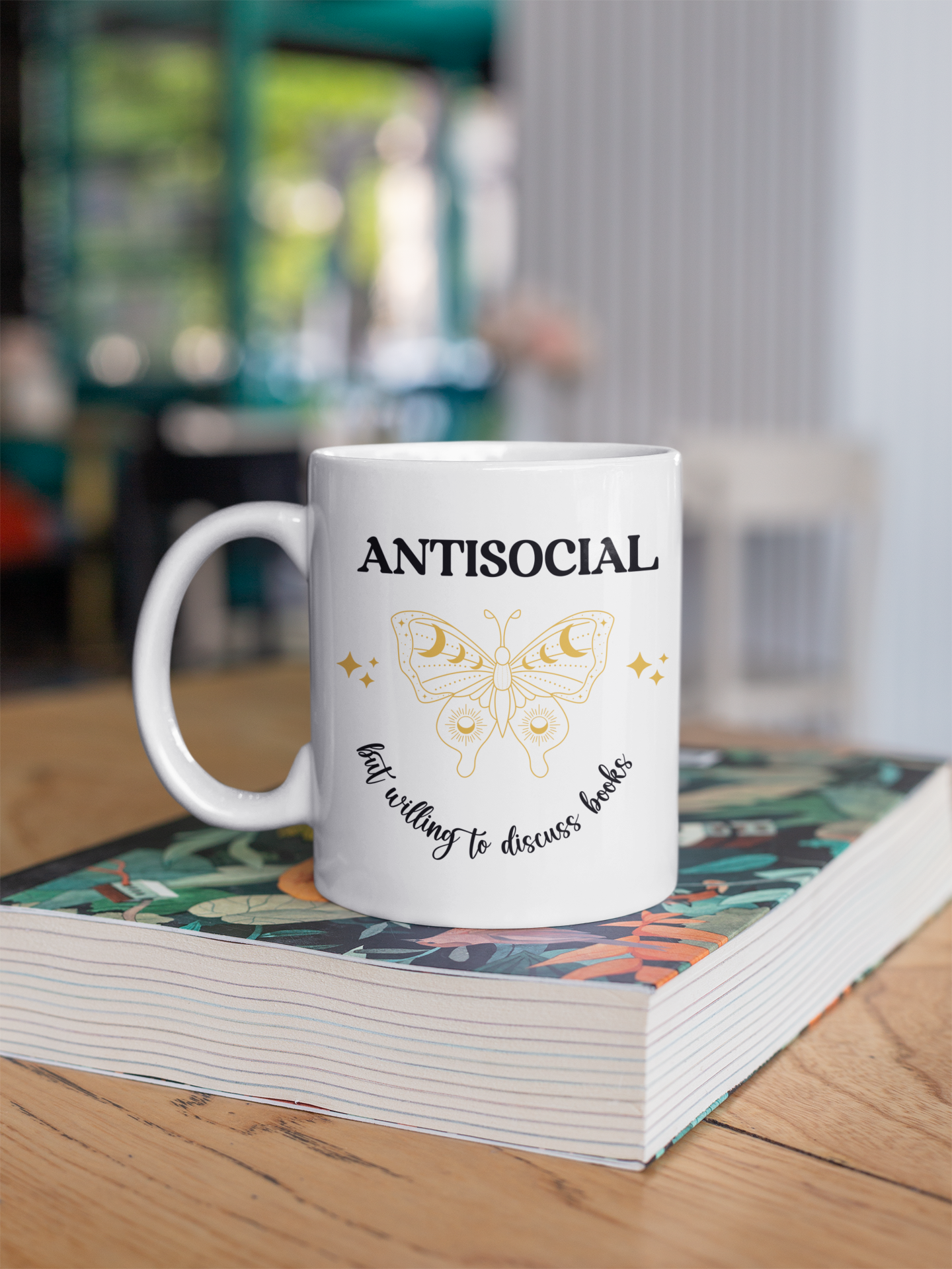 Mockup of Antisocial Book Club White Mug on book stack