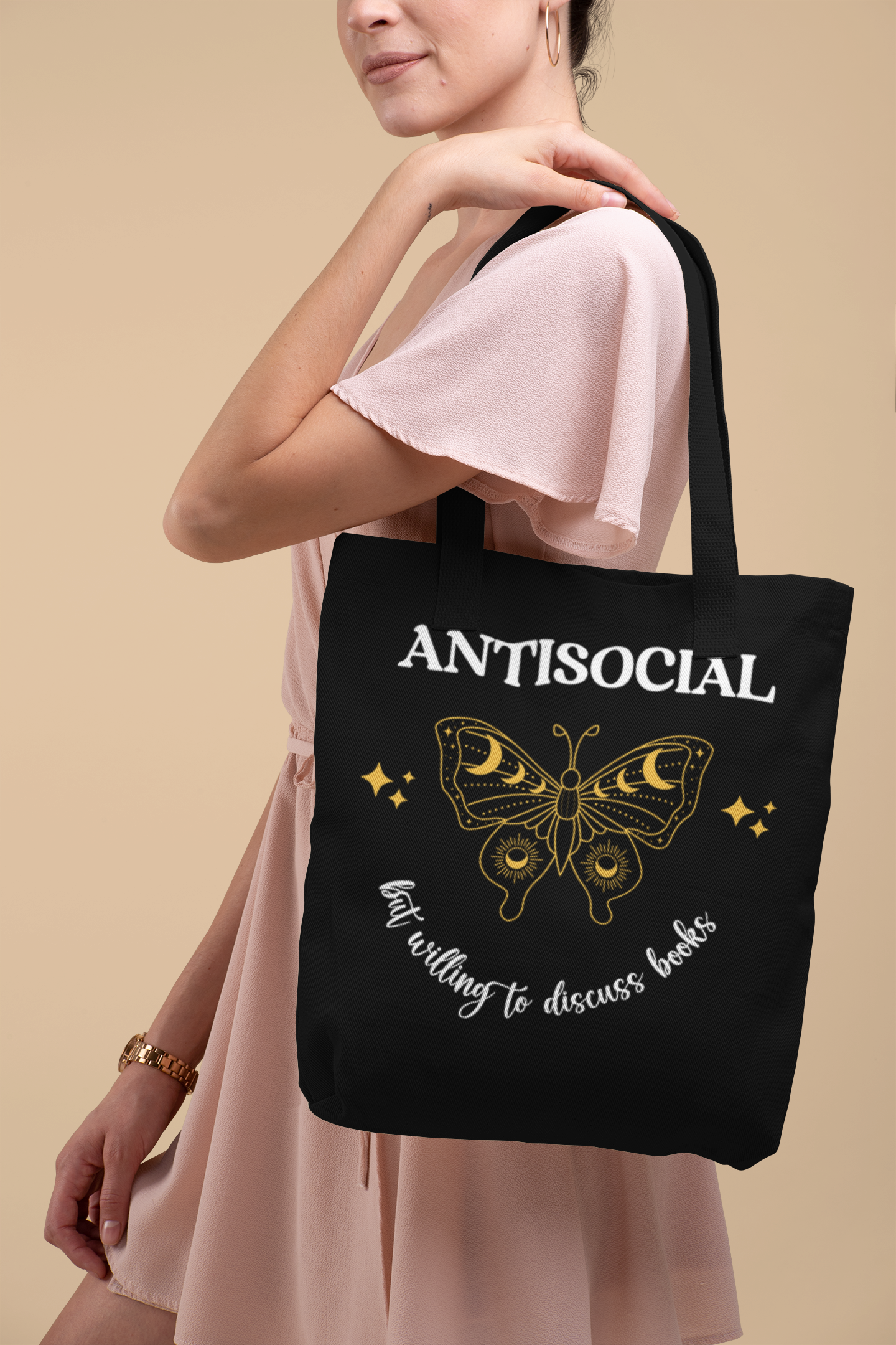Mock up of Woman in a pink dress holding the Antisocial Book Club Tote Bag
