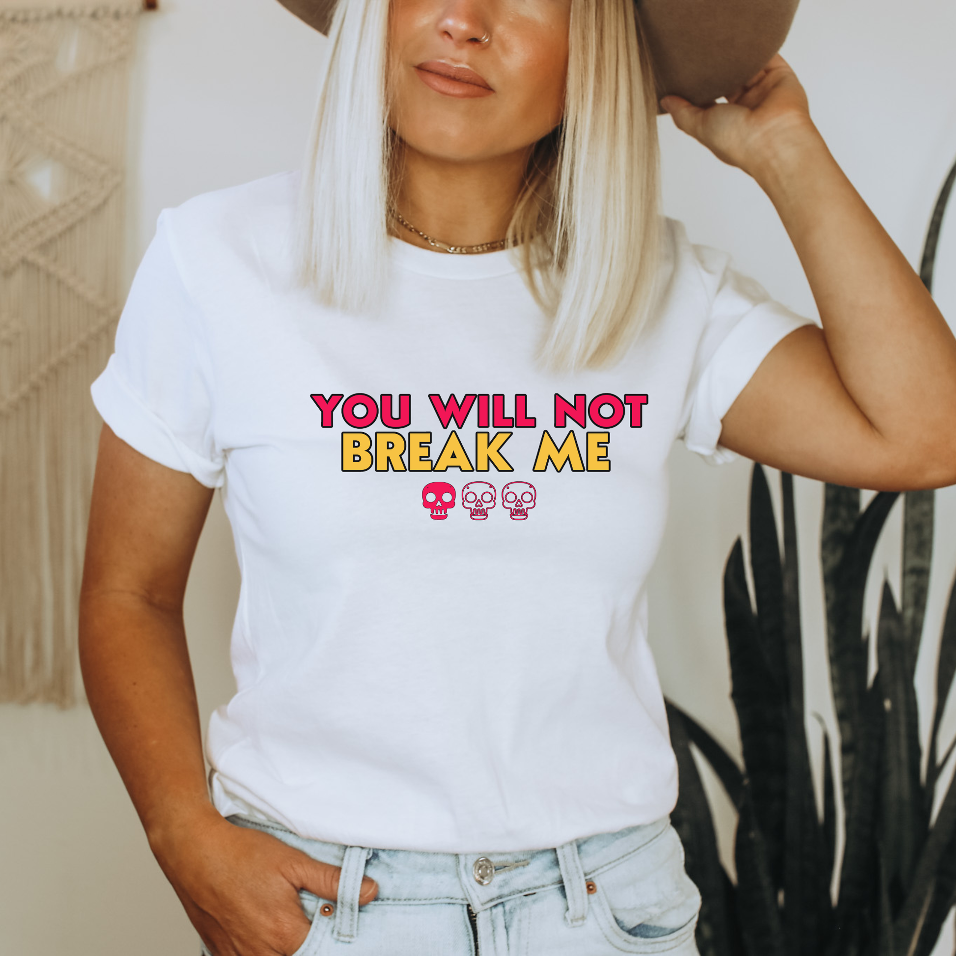 Person wearing a white t-shirt with 'YOU WILL NOT BREAK ME' text design inspired by Dungeon Crawler Carl | Starlit Prose Bookish Merch Australia