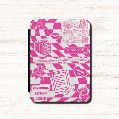 This playful pink Kindle case features a pink and white checkerboard background covered with cute illustrated details — from roses, books and iced lattes to a coquette bow, lips and a tiny bandaged Kindle. The design includes text that says "Romance Ave," "Emotionally Attached to Fictional Characters," "Emotional Support Kindle" and "Self Love Club" for a case that perfectly captures the experience of being a romance reader. Designed by Starlit Prose bookish merch australia.