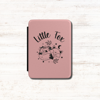 A pink textured Kindle Case Cover- Once Upon a Broken Heart design featuring a black line art illustration of a little fox, flowers, stars, and the words 'Little Fox'. Designed by Starlit Prose Bookish Merch Australia.