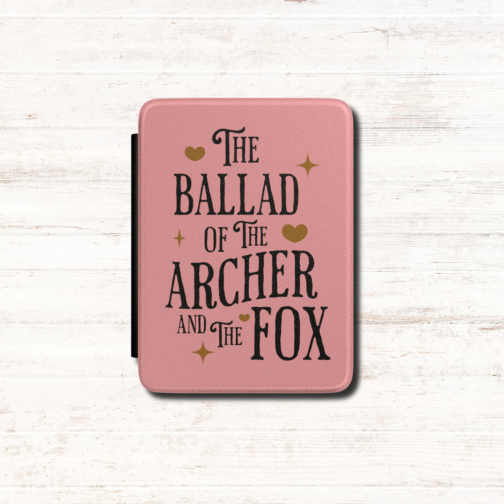 Once Upon a Broken Heart textured pink Kindle Case Cover, it says "The Ballad of the Archer and the Fox" and includes small gold illustrations including stars and hearts. Designed by Starlit Prose Bookish Merch Australia.