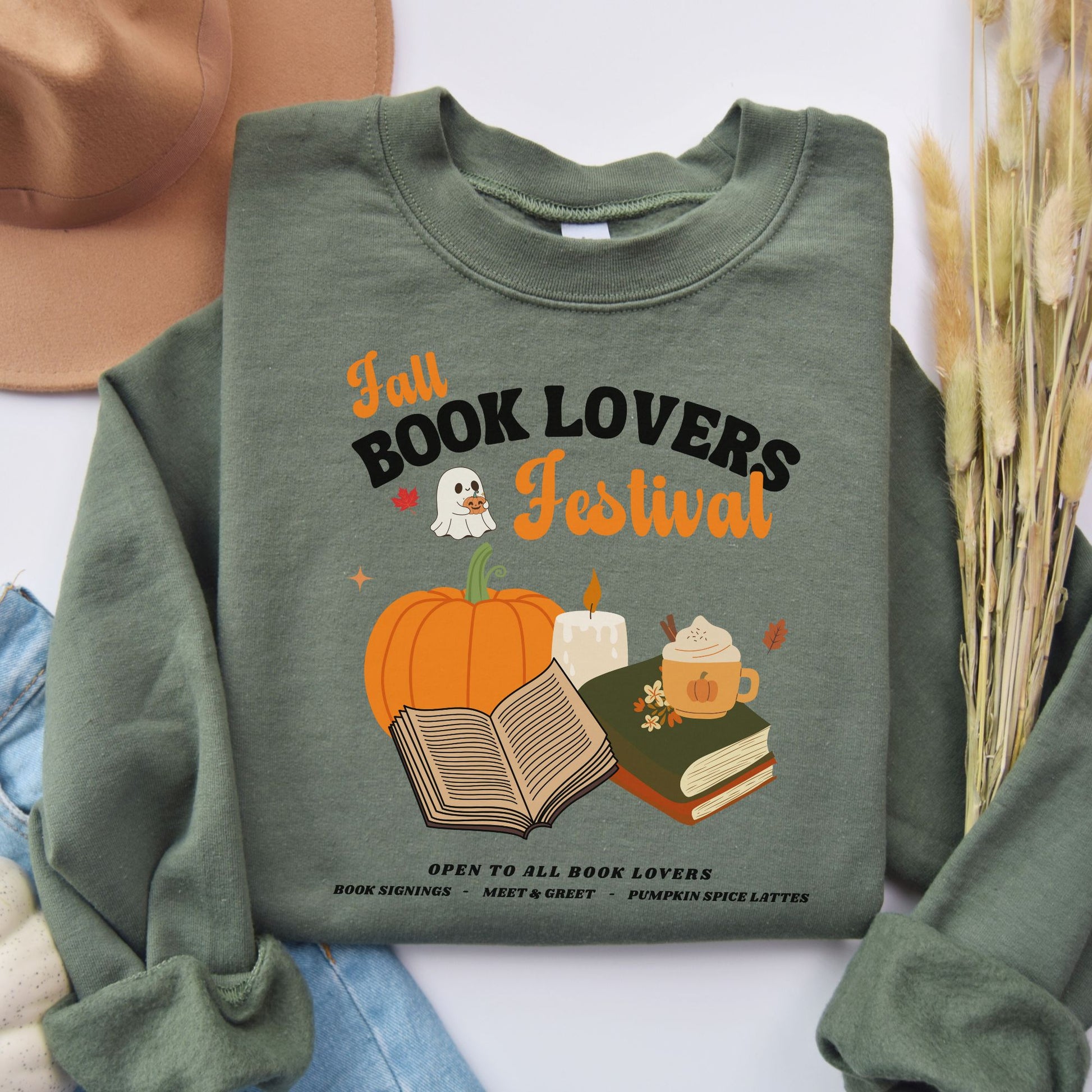Green sweatshirt with 'Fall Book Lovers Festival' design featuring a pumpkin, books, and a ghost for a fictional Book Lovers Festival. Starlit Prose Bookish Merch Australia