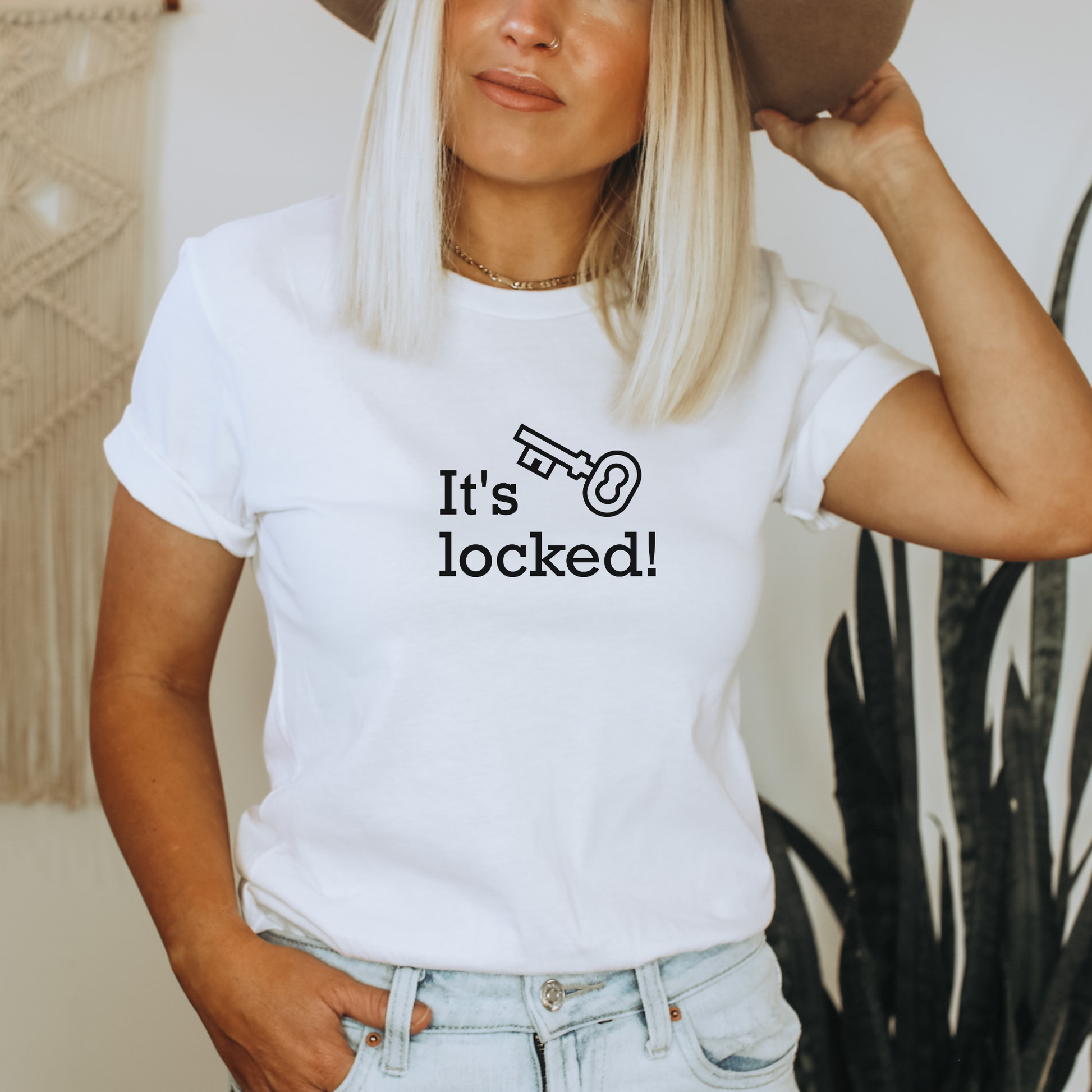 White shirt with text that says "It's locked" with a graphic of a key