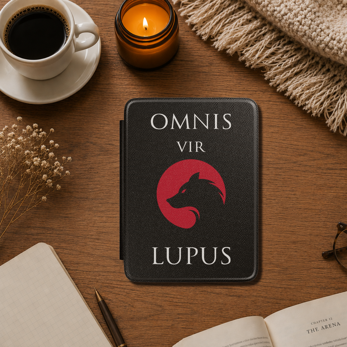 Black textured Red Rising Kindle case, featuring bold white text that says "Omnis vir Lupus" and a silhouette of a wolf within a red Moon circle. Designed by Starlit Prose Bookish merch Australia.