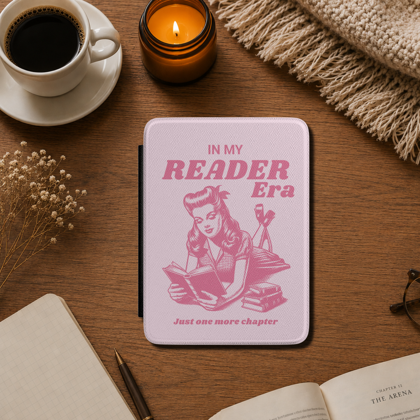 This playful pink Bookish In my Reader Era Kindle case features a vintage pin-up-inspired reader lounging with her book, paired with the phrases "In My Reader Era" and "Just One More Chapter." Pink background. Designed by Starlit Prose Bookish Merch Australia.