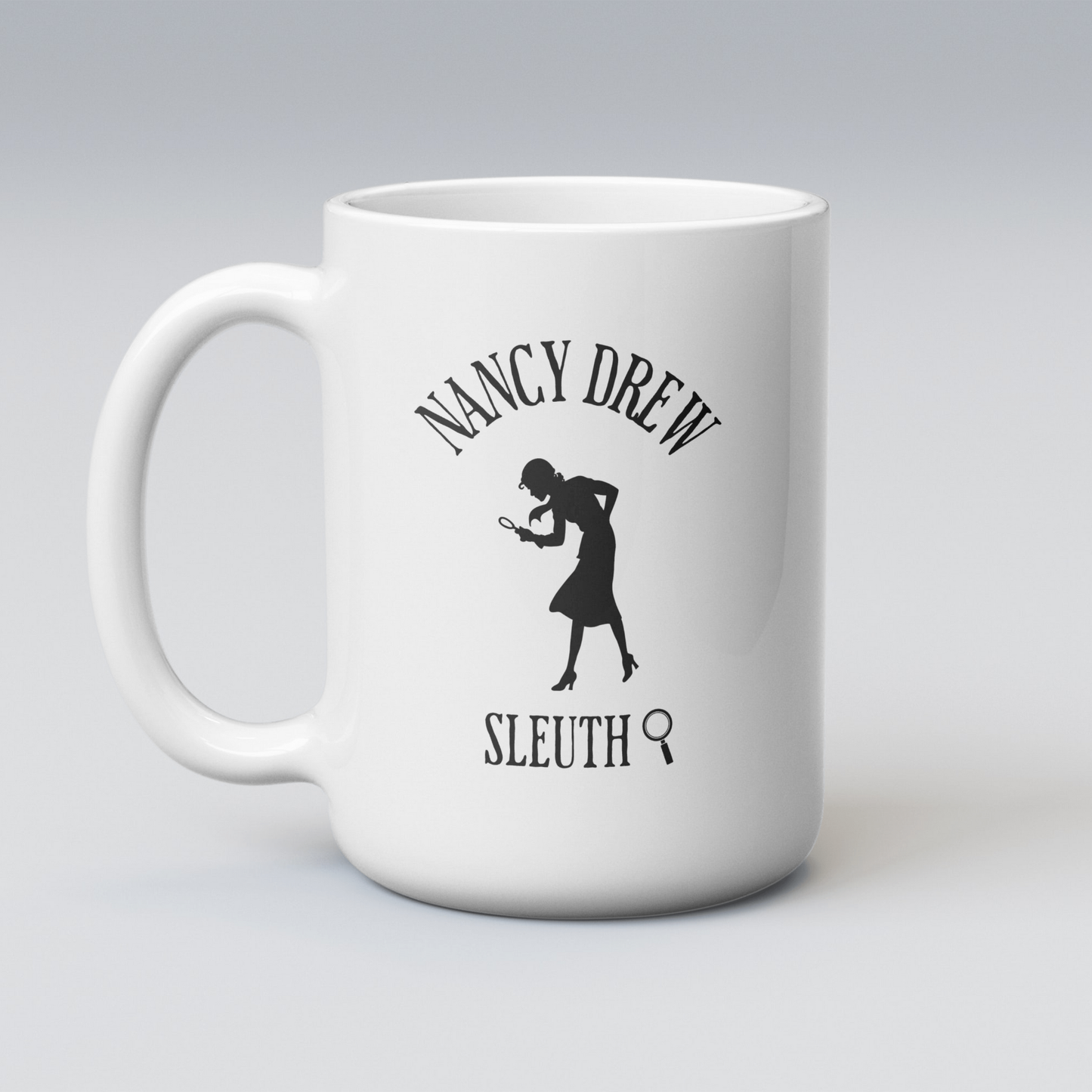 White mug with Nancy Drew Sleuth silhouette design on a gray background