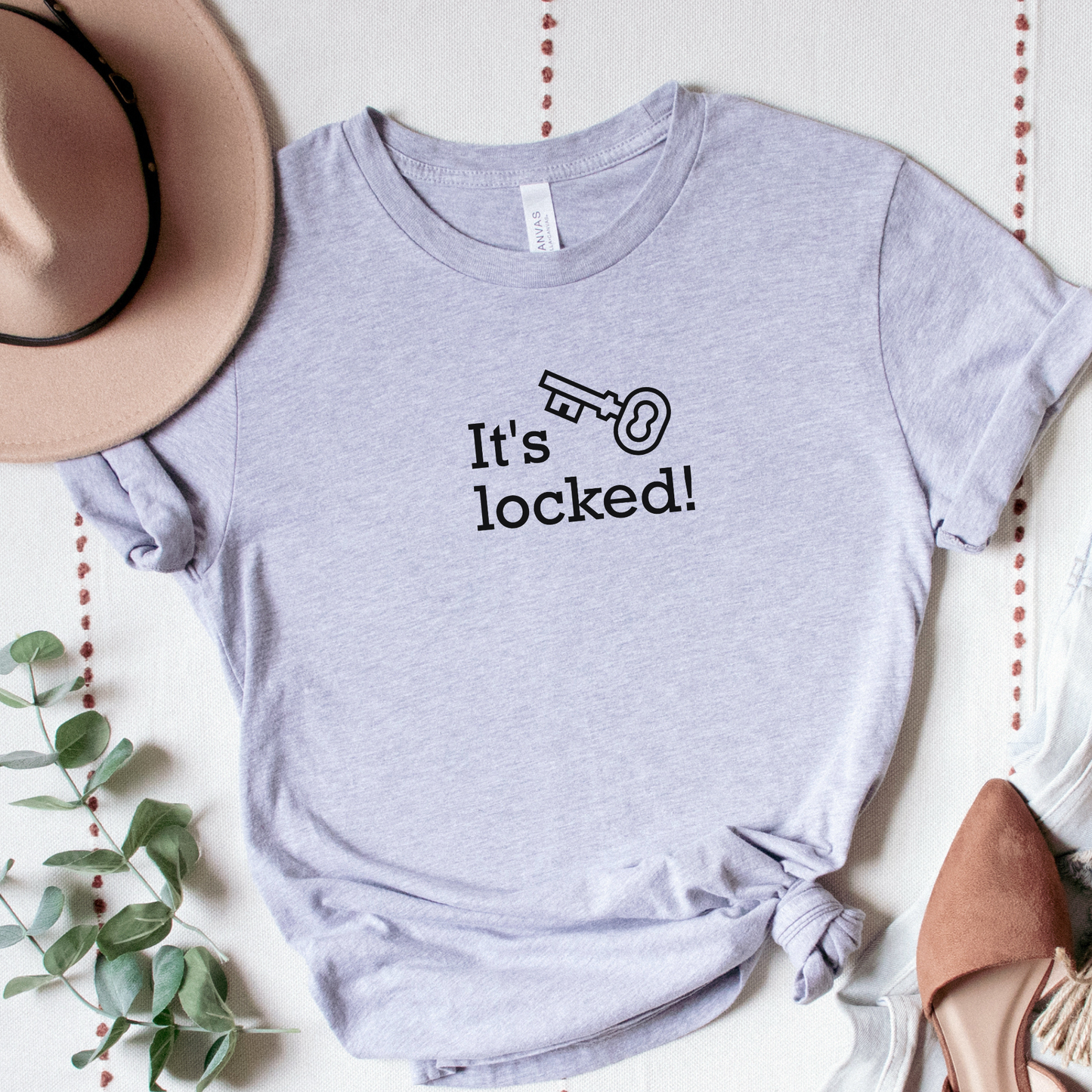 grey shirt with text that says "It's locked" with a graphic of a key