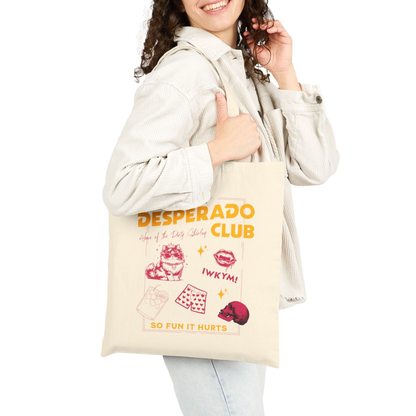 Person holding a Dungeon Crawler Carl Desperado Club Tote Bag design | Starlit Prose Bookish Merch Australia