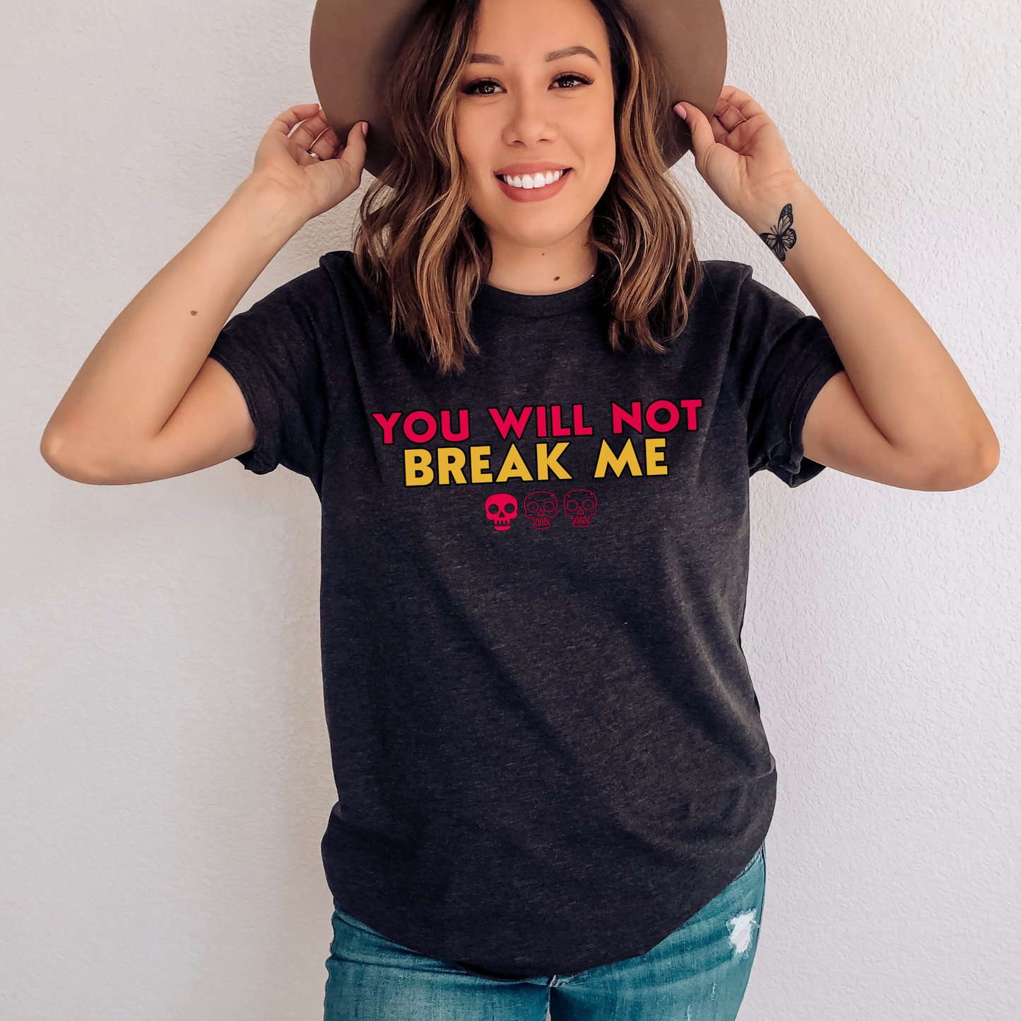 Person wearing a Dark Grey Heather t-shirt with 'YOU WILL NOT BREAK ME' text design inspired by Dungeon Crawler Carl | Starlit Prose Bookish Merch Australia