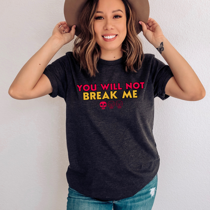 Person wearing a Dark Grey Heather t-shirt with 'YOU WILL NOT BREAK ME' text design inspired by Dungeon Crawler Carl | Starlit Prose Bookish Merch Australia
