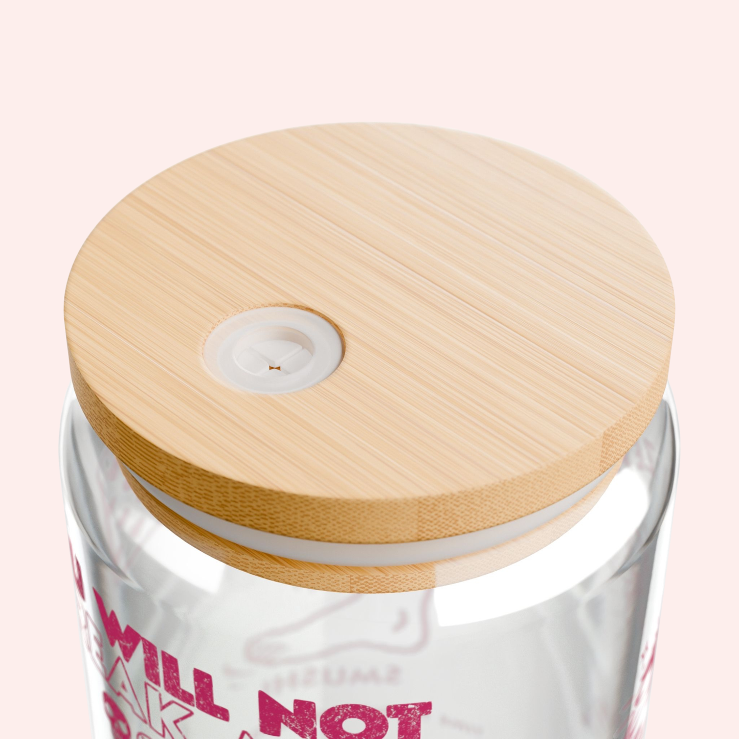 Glass tumbler with wooden lid on a white background