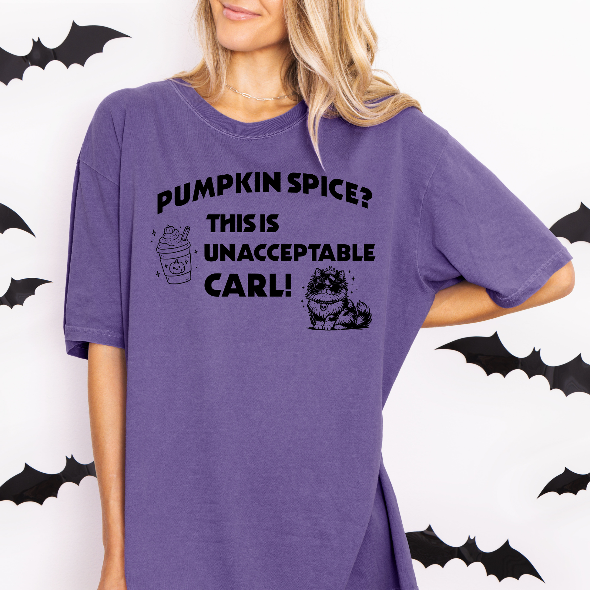 A woman wearing a Grape purple Comfort Colors t-shirt with the text 'PUMPKIN SPICE? THIS IS UNACCEPTABLE CARL!' and a pumpkin spice latte, with Princess Donut  illustration. Designed by Starlit Prose Bookish merch Australia