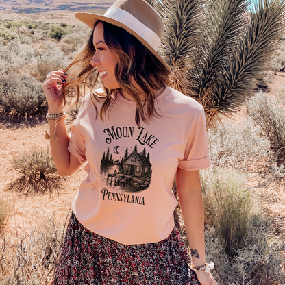 heather peach t-shirt with 'Moon Lake Pennsylvania' graphic design on a light background