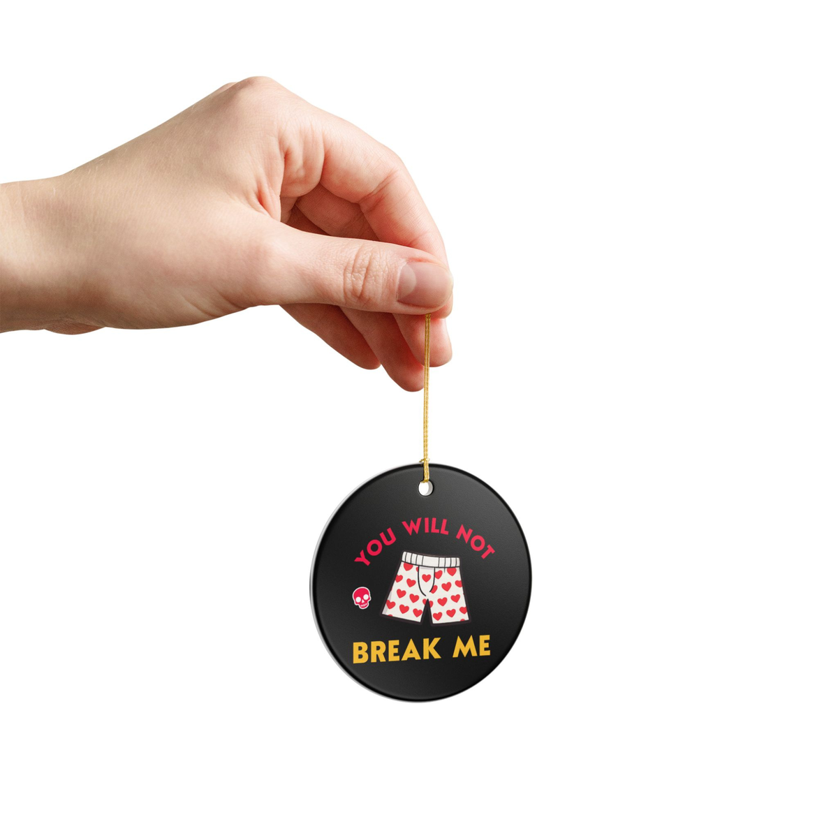 Bookish Ceramic Ornament - Round black Dungeon Crawler Carl Xmas Ornament. It features bold yellow and pink text that says "You Will Not Break Me " with Carl's iconic boxer pajama shorts and a skull. Designed by Starlit Prose Bookish Merch Australia.