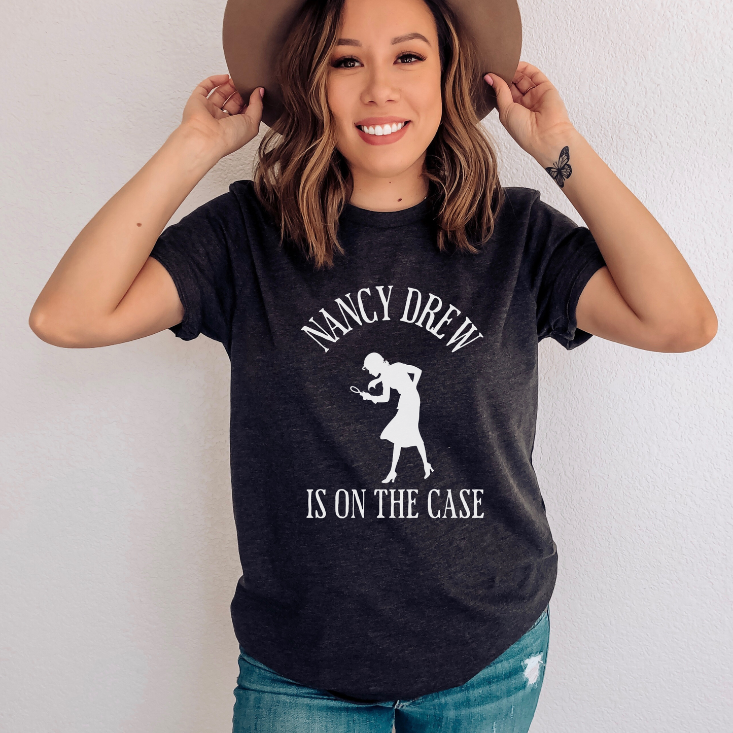 Dark Grey Heather Shirt that says "Nancy Drew is on the Case" with a sihouette of Nancy Drew