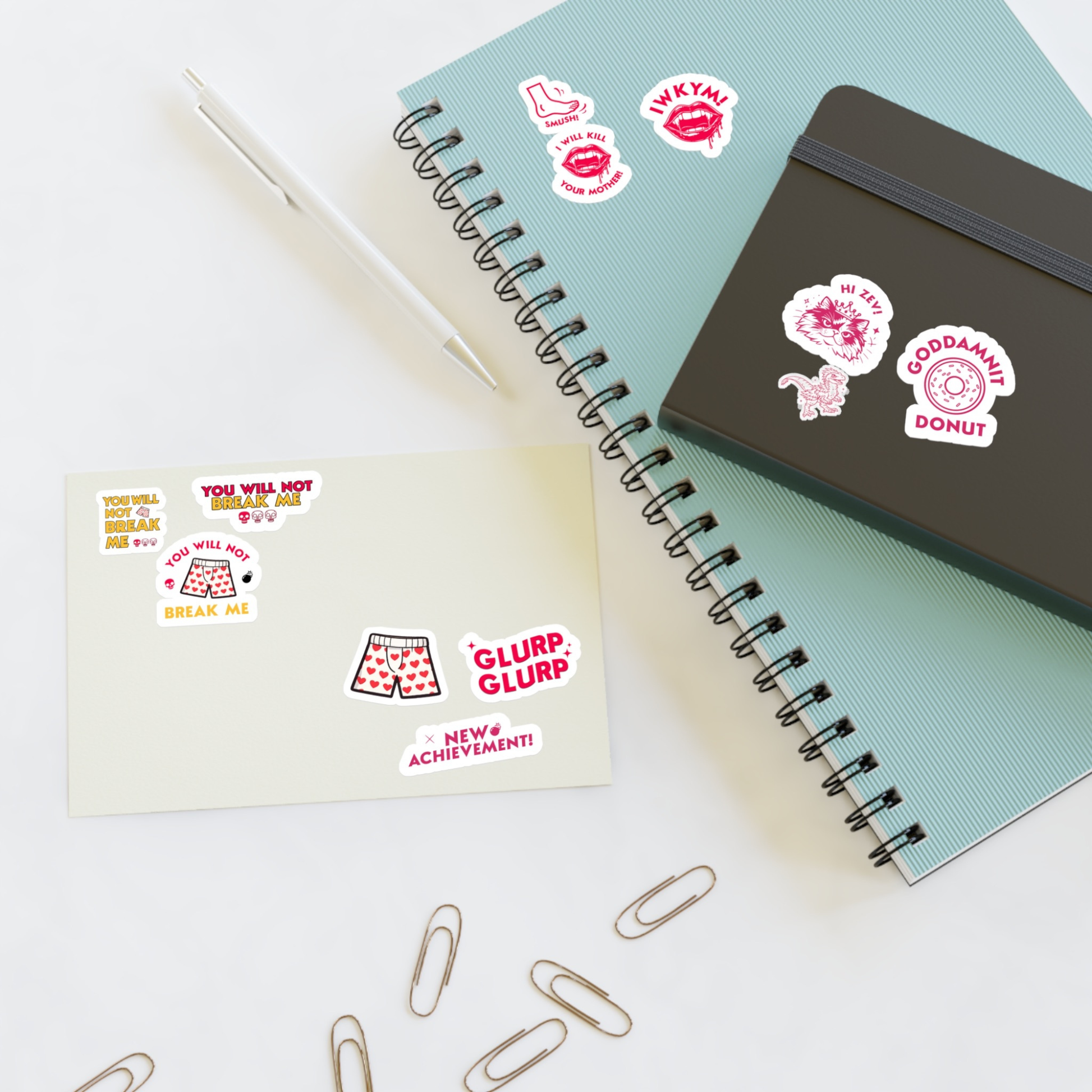6"x 4 " Dungeon Crawler Carl Sticker Sheet shown on desk and notebook | Starlit Prose Bookish Merch Australia