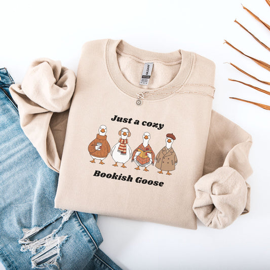 Sand sweatshirt with cartoon geese and text on a white background