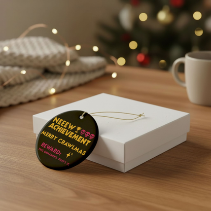 Bookish Ornament - Dungeon Crawler Carl themed round black ornament with bold yellow text that says "NEW ACHIEVEMENT, MERRY CRAWLMAS" in bold pink text it says "Reward, this ornament. Thats it" with a star illustration and trophy with 3 pink skulls. Also shows the plain white gift box option. Designed by Starlit Prose Bookish Merch Australia.