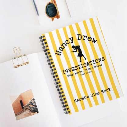 Bookish Notebook design features a cheerful yellow and white striped background with a Nancy Drew Investigations theme and a personalised section where you can add the recipient's name. It includes an icon of Nancy Drew with her magnifying glass. Designed by Starlit Prose Bookish Merch Australia.