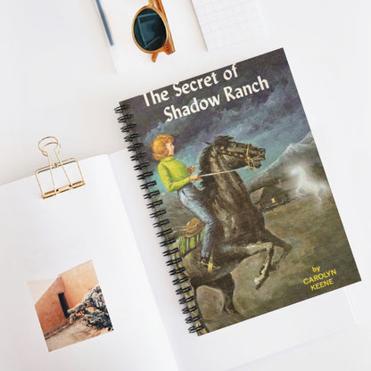 This Nancy Drew bookish notebook features the classic book cover design of The Secret of Shadow Ranch by Carolyn Keene. Designed by Starlit Prose Bookish Merch Australia.