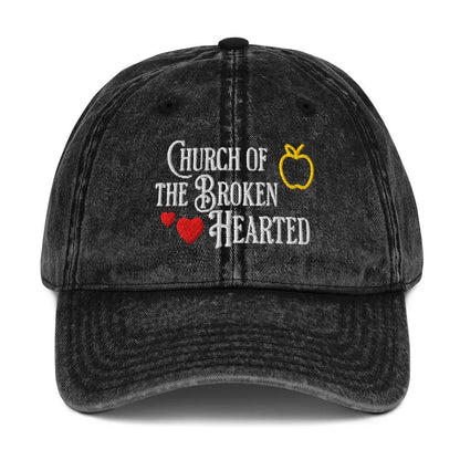 Once Upon a Broken Heart embroidered hat , distressed Vintage style hat features text that says “Church of the Broken Hearted”, with a delicate gold apple outline, and tiny red hearts. Designed by Starlit Prose Bookish Merch Australia.
