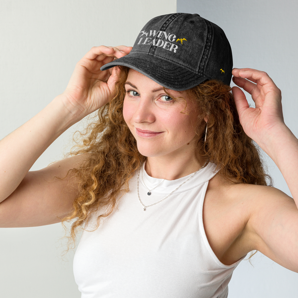 Woman wearing Wing Leader Black Dad Hat with a small gold dragon on the left side of hat| Dragon Rider Bookish Merch | Ink and Stories