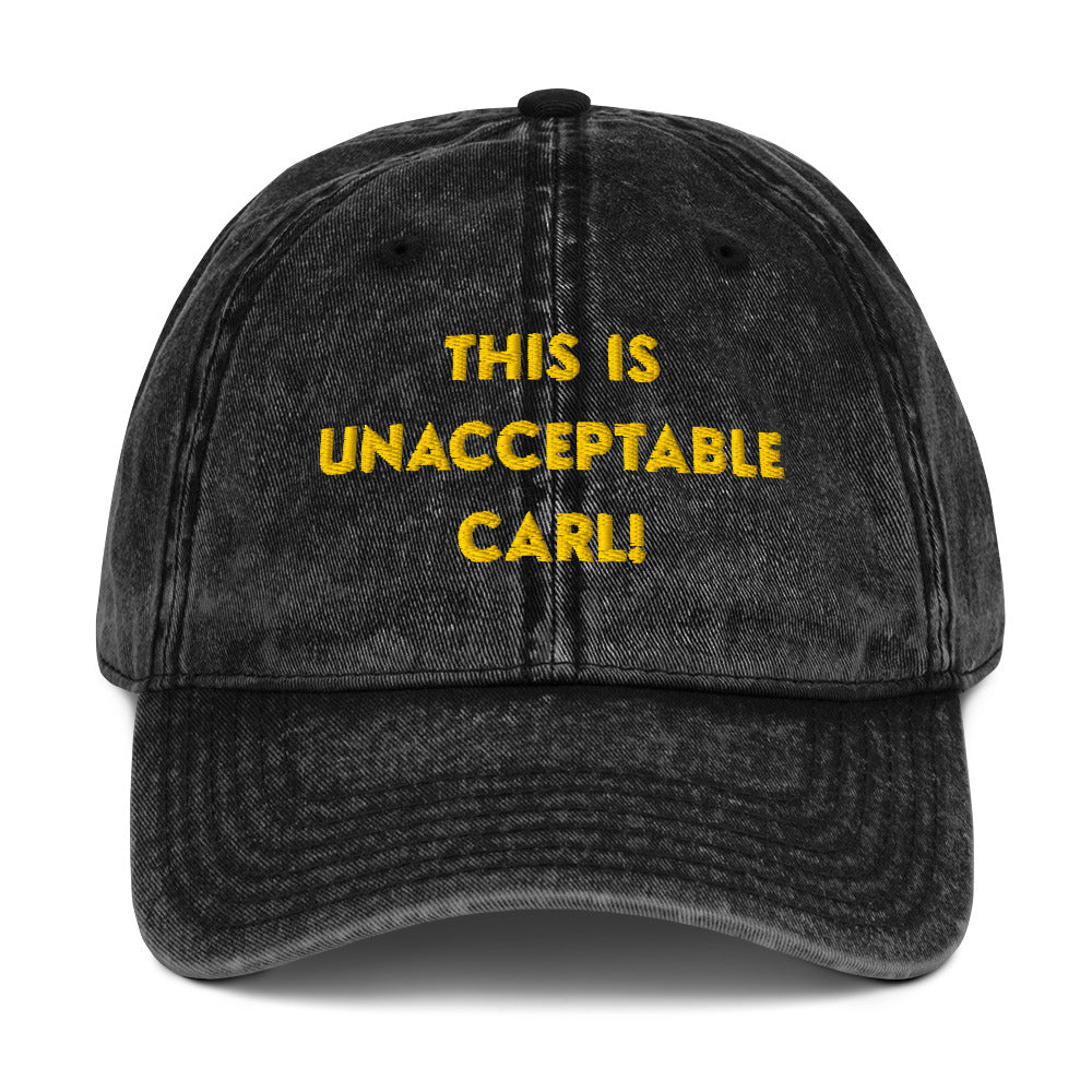 A washed black denim baseball cap that says "This is unacceptable Carl" in yellow embroidered text. Quote from Princess Donut of Dungeon Crawler Carl book series. Designed by Starlit Prose Bookish Merch Australia