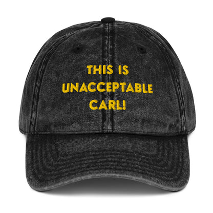 A washed black denim baseball cap that says "This is unacceptable Carl" in yellow embroidered text. Quote from Princess Donut of Dungeon Crawler Carl book series. Designed by Starlit Prose Bookish Merch Australia