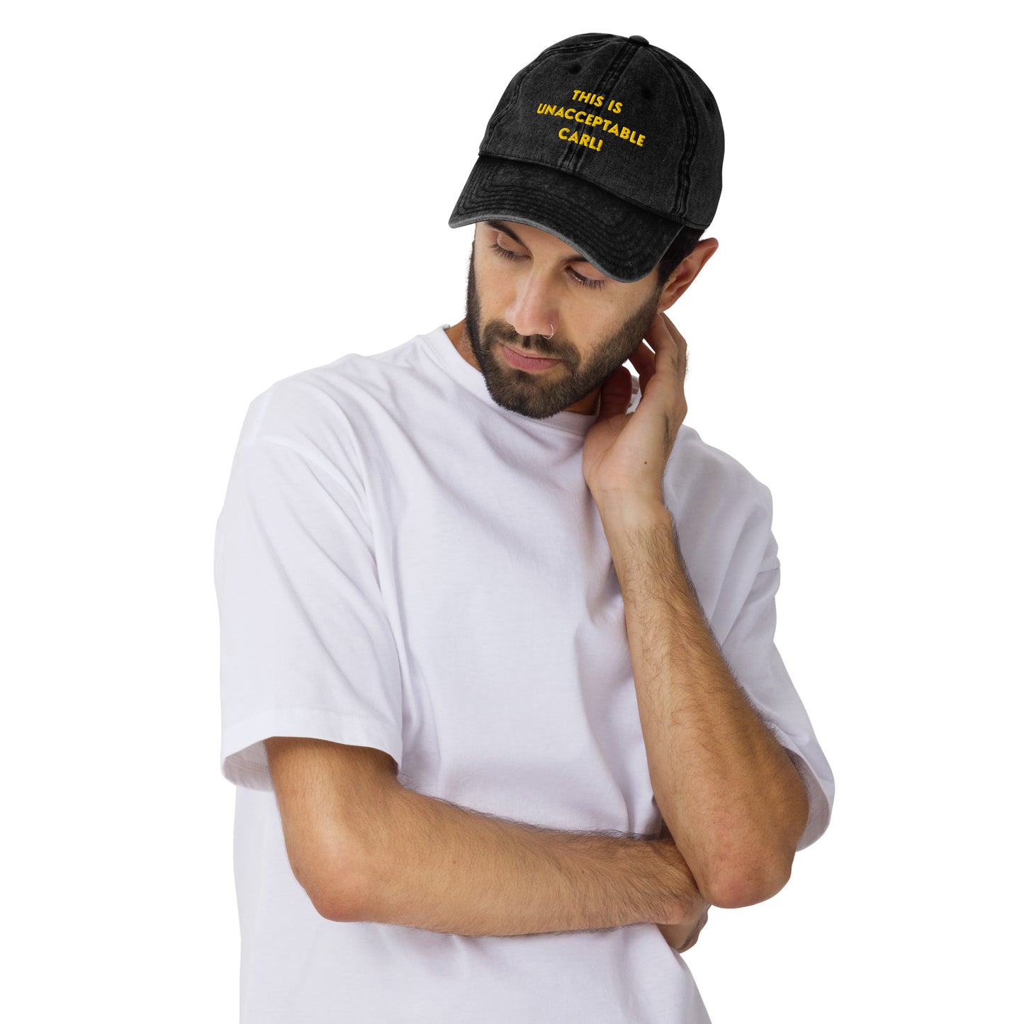 Man wearing A washed black denim baseball cap that says "This is unacceptable Carl" in yellow embroidered text. Quote from Princess Donut of Dungeon Crawler Carl book series. Designed by Starlit Prose Bookish Merch Australia