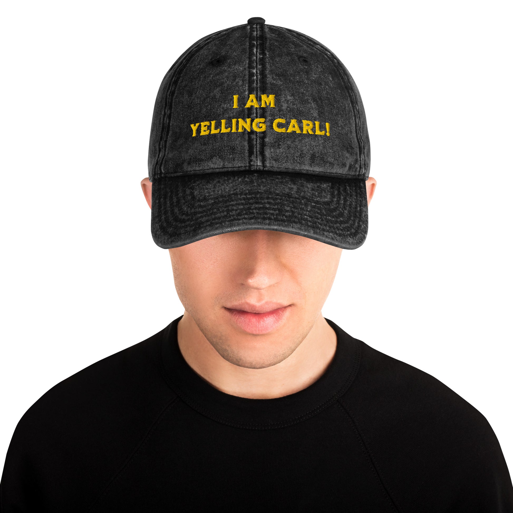 Person wearing A black acid-wash baseball cap with yellow embroidered text reading 'I AM YELLING CARL!' a quote from Princess Donut of Dungeon Crawler Carl book series on the front, shown against a plain white background. Designed by Starlit Prose Bookish Merch Australia