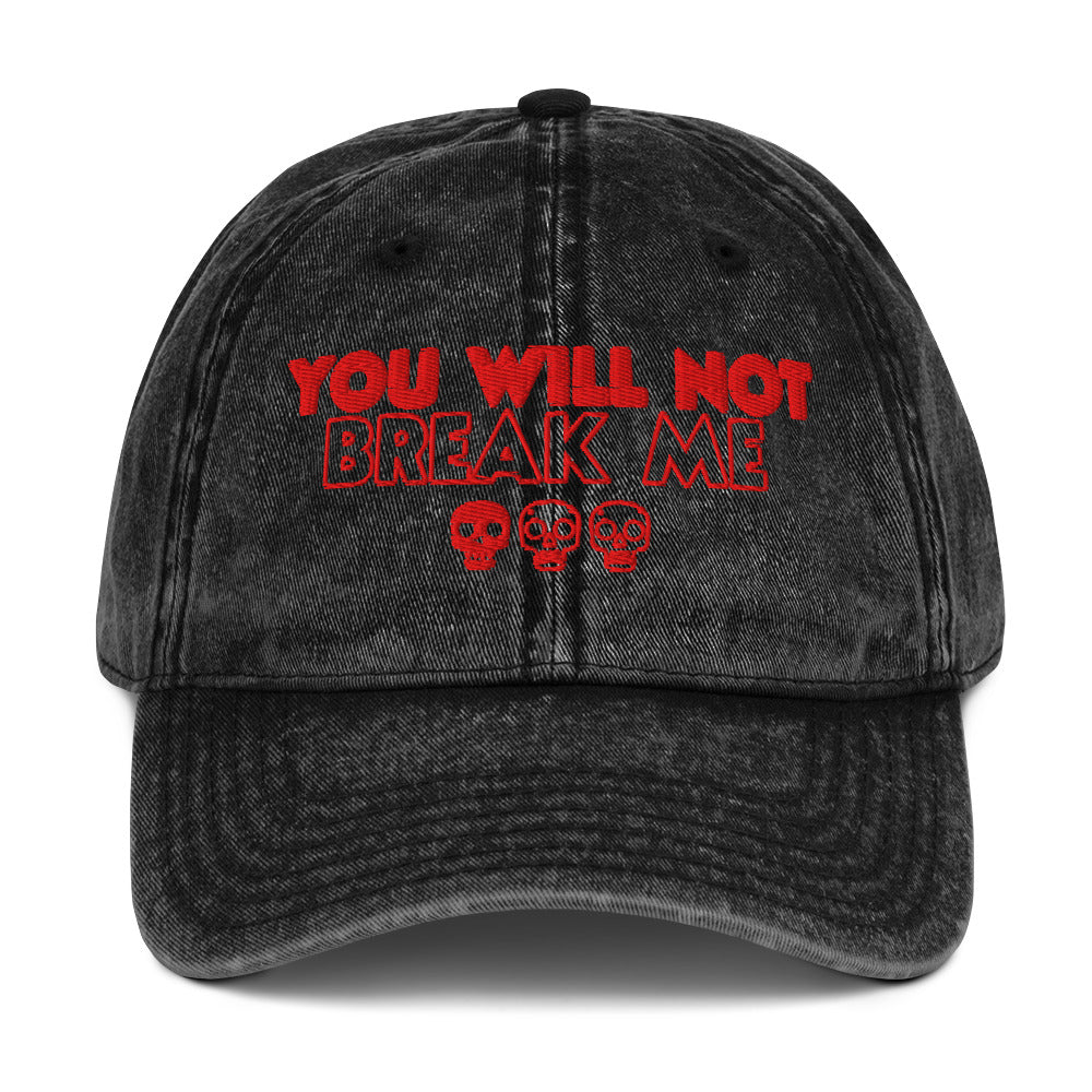  a black acid washed denim cap, it says "You will not break me" in red embroidered text with 3 skulls. This is a quote from Dungeon Crawler Carl, it was designed by Starlit Prose Bookish Merch Australia