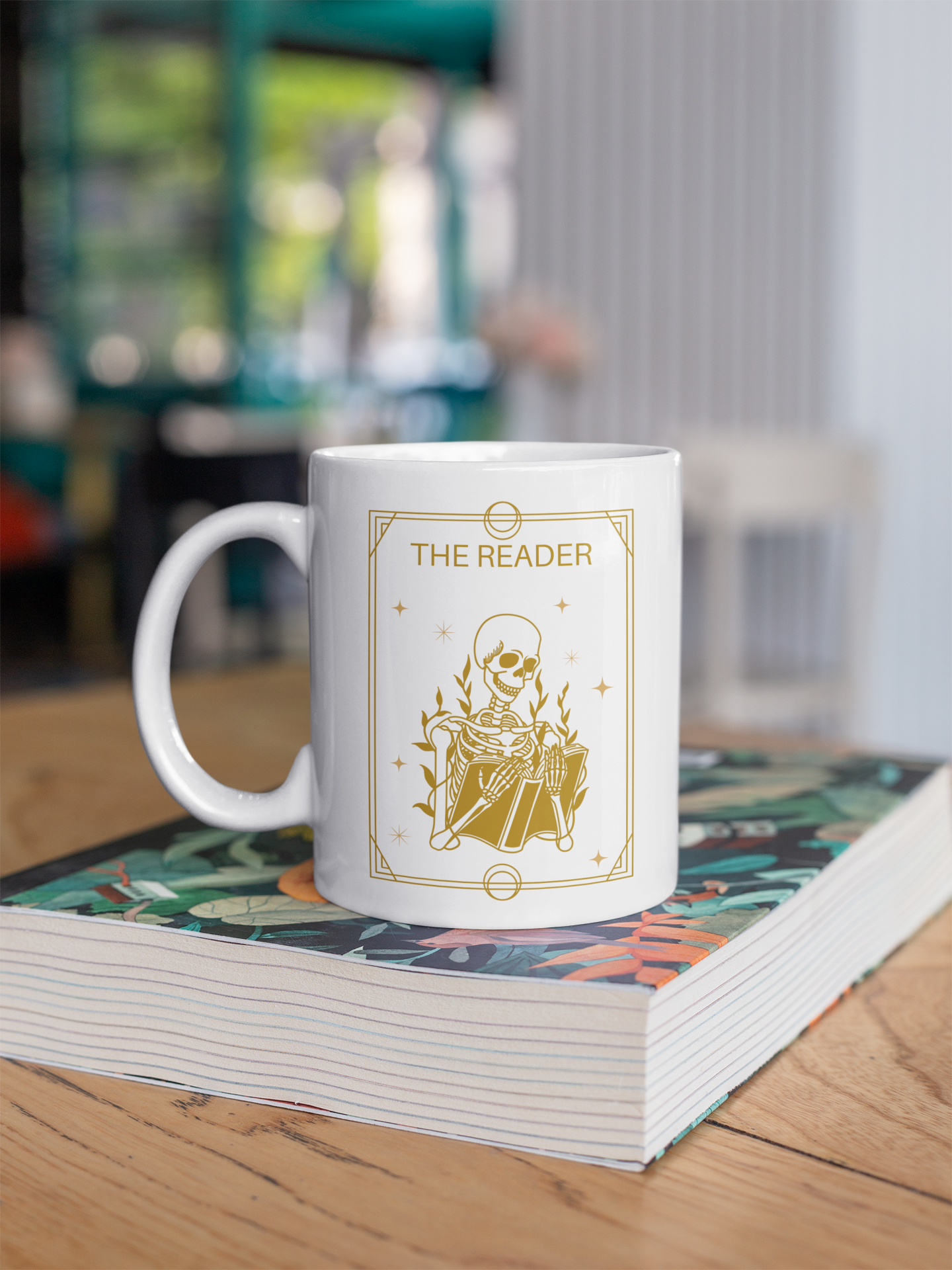 The Reader Tarot Card Bookish Mug mockup of mug sitting on a book