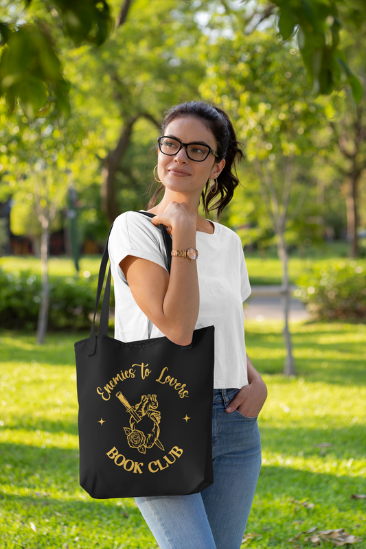 Mock up of Woman with glasses wearing Enemies to Lovers Book Club Tote Bag |