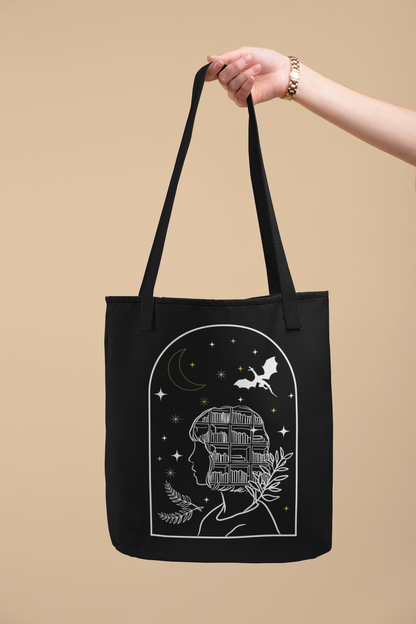 Arm holding the Bookish Fantasy Girl Tote Bag