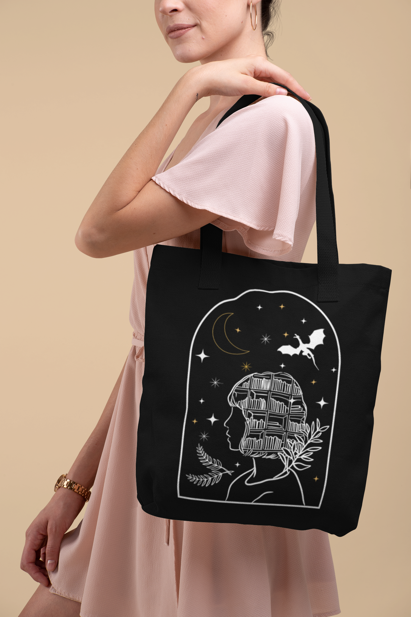Woman in pink dress holding the Bookish Fantasy Girl Tote Bag