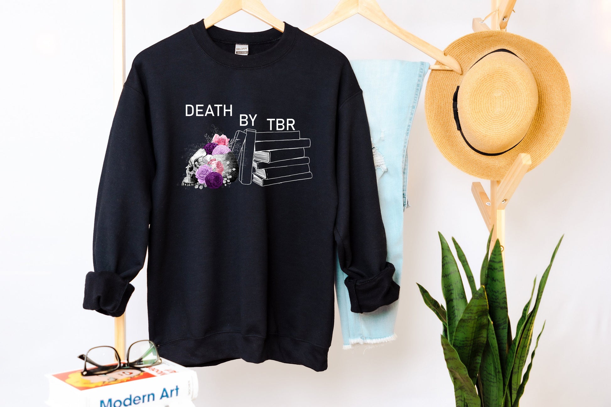 Death by TBR Black sweatshirt hanging up